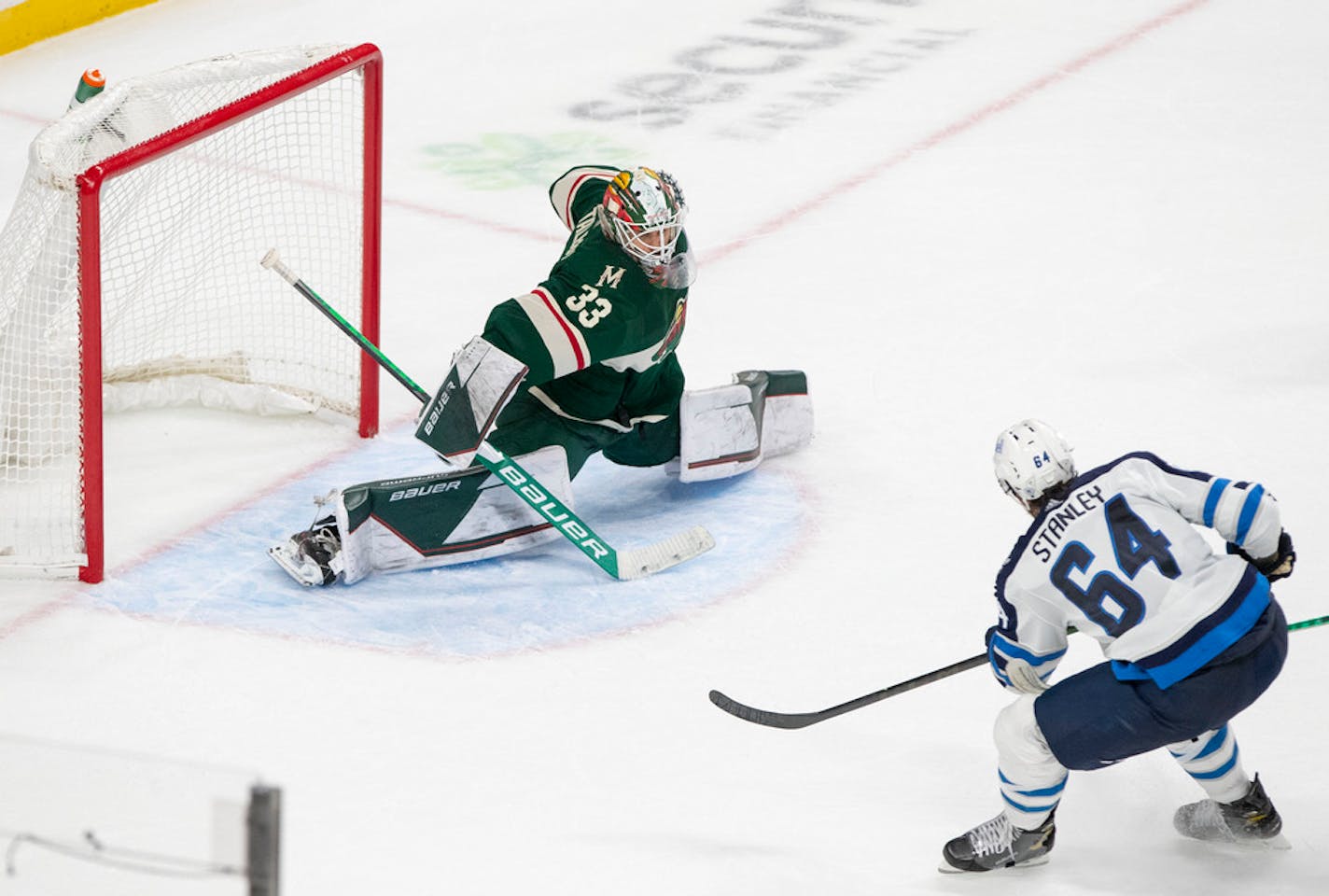 Minnesota Wild goaltender Cam Talbot (33) made a save in a shot by Winnipeg Jets defenseman Logan Stanley (64) in overtime Tuesday, Oct. 19, 2021 at Xcel Energy Center in St. Paul, Minn.   ]