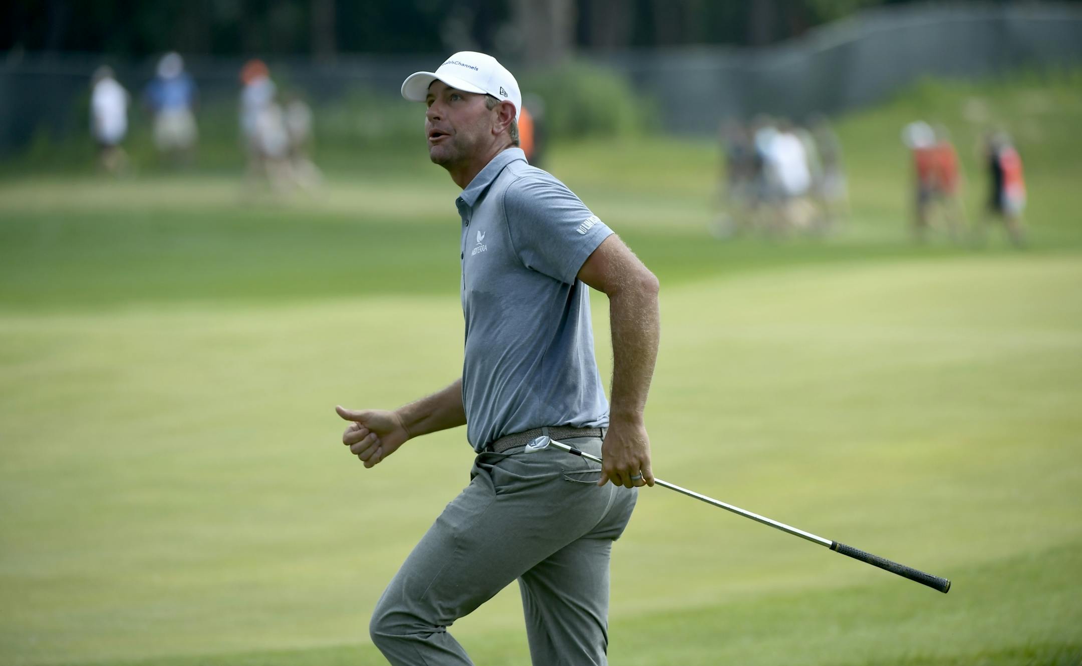 Lucas Glover watched his shot after hitting out of the rough on the18th hole during the final day of the 3M Open at TPC Twin Cities.