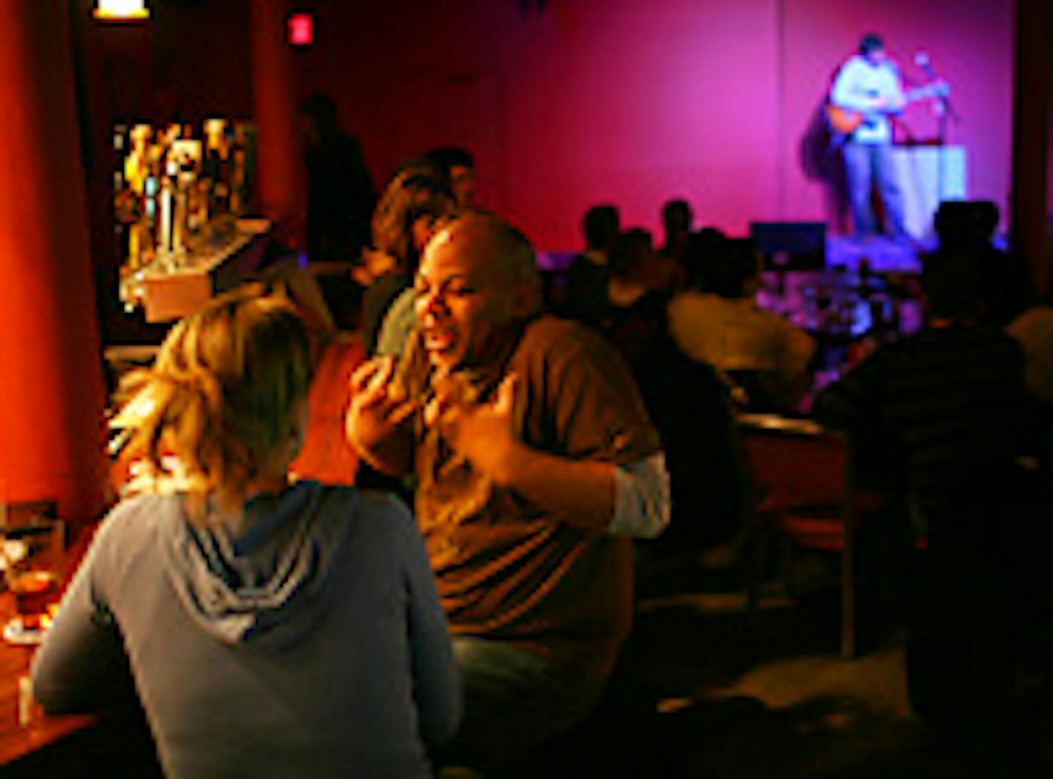 Che Zachary had an animated conversation with Ingrid Werthmann at the Acadia Cafe during a show by singer/songwriter Jim Buri.