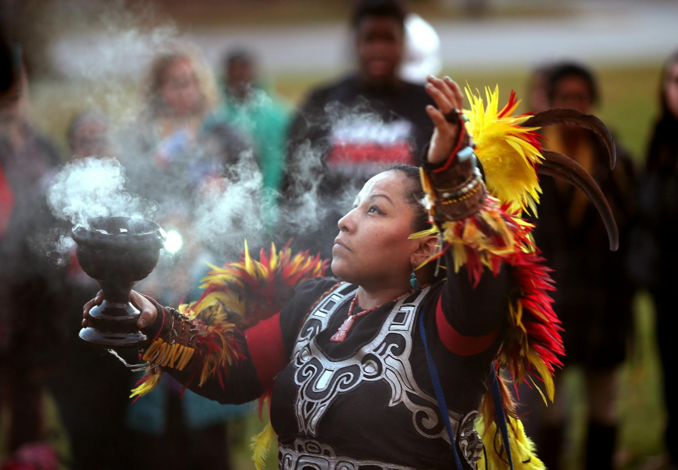 Indigenous dancers prayed to the four directions and burned sage at the site where Jamar Clark was killed in a confrontation with city police last fall to commemorate his death Tuesday October 15, 2016 in Minneapolis, MN.