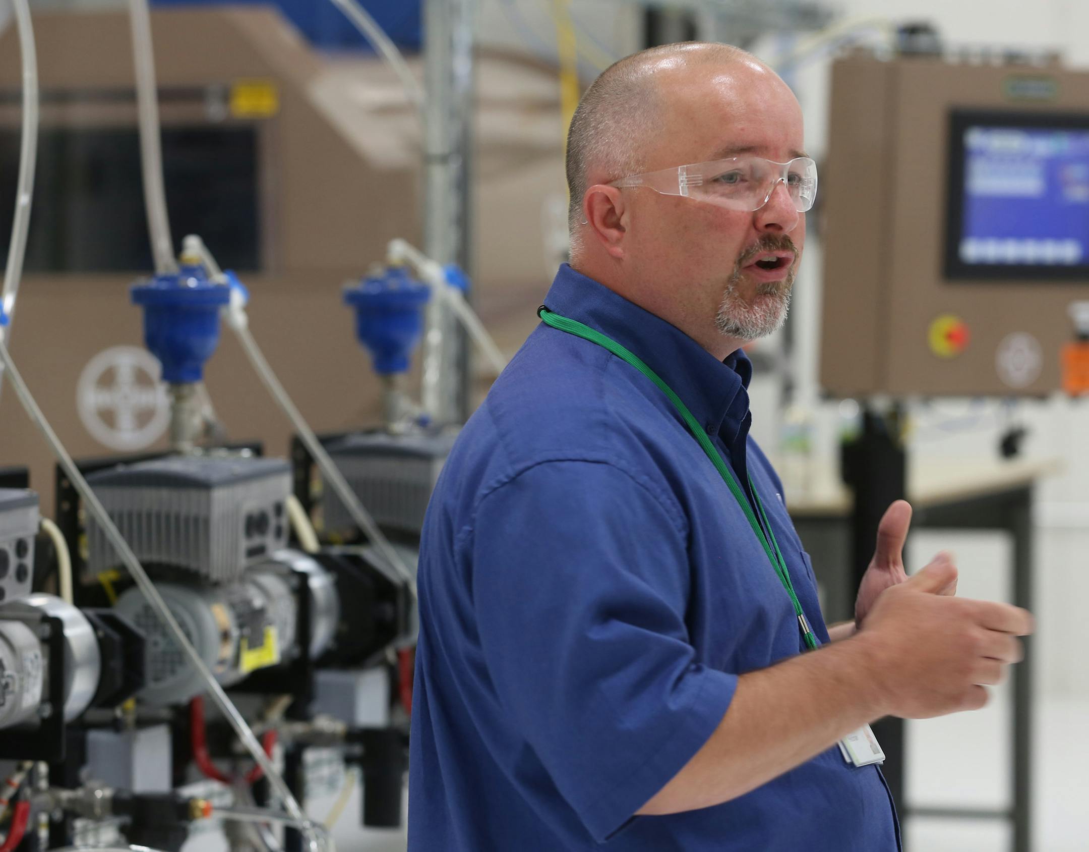 Josh Heitzman talked about the new seed coater they have at the new Bayer CropScience facility. ] (KYNDELL HARKNESS/STAR TRIBUNE) kyndell.harkness@startribune.com Dedication of a new $12 million seed innovation center in Shakopee. Bayer CropScience to hold the grand opening and tour of new facilityin Shakopee, Min., Thursday, July 9, 2015.