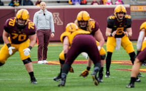 Gophers football coach P.J. Fleck watches over a workout