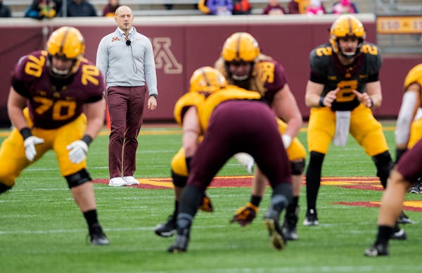 Gophers football coach P.J. Fleck watches over a workout