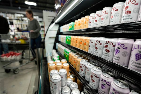 Cans of Olipop, a drink containing botanicals, plant fibers, and prebiotics, displayed at a Kroger supermarket, Friday, April 12, 2024, in Marietta, G