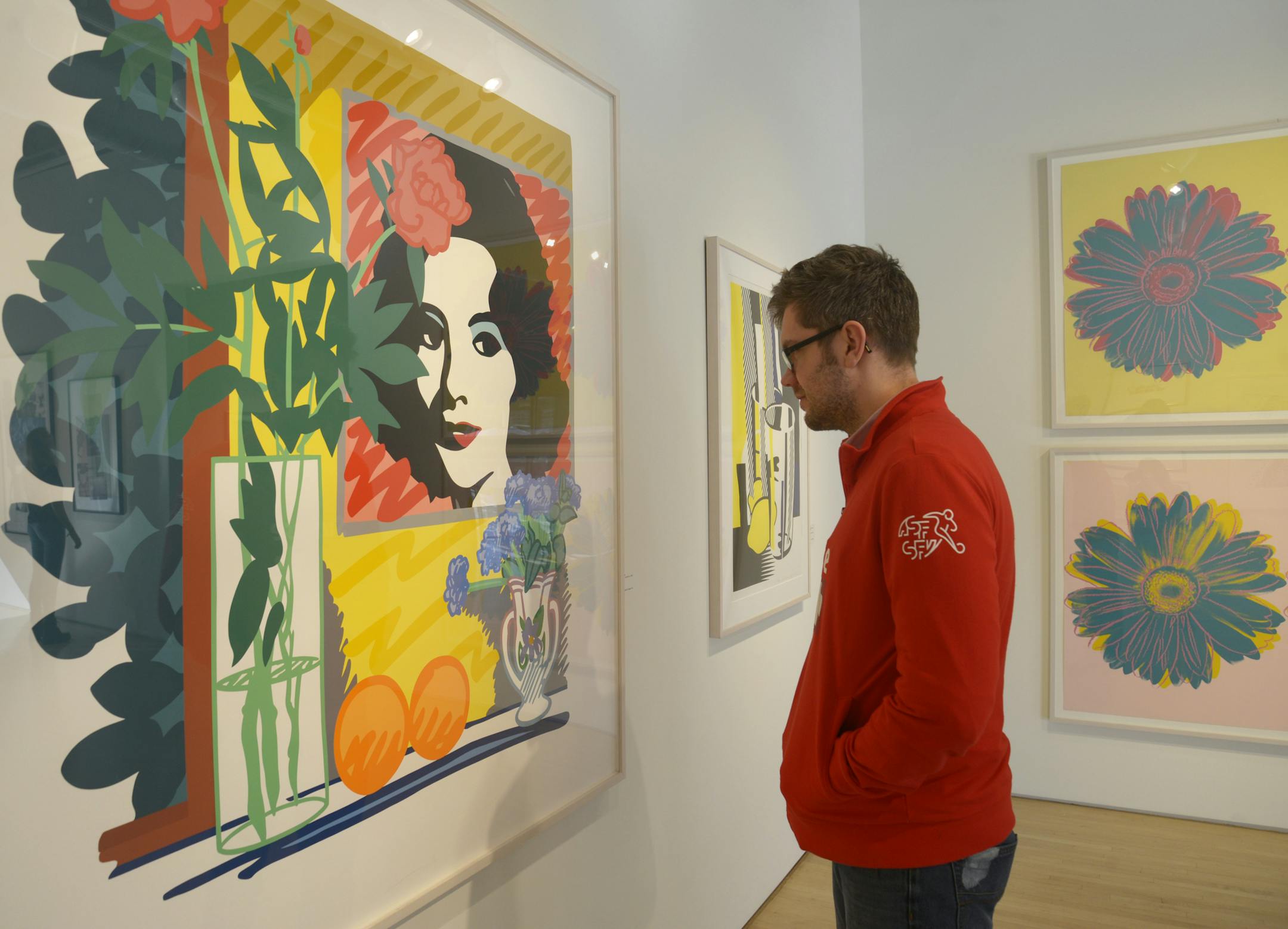 Josh Bindewald of High Point Center for Printmaking walks through the gallery, stopping at Tom Wesselman's "A Still Life with Liz" in Minneapolis on Friday, February 14, 2014. ] (AMANDA SNYDER/ Special to the Star Tribune)