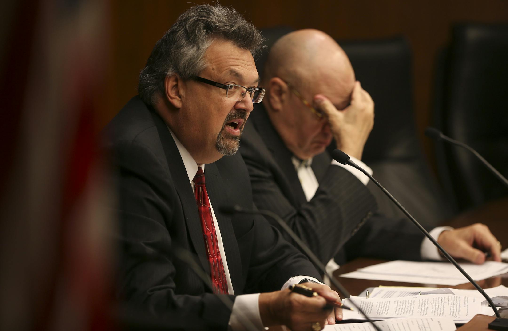 Retired Minnesota Supreme Court Justice Eric Magnuson, left, chair of the Sex Offender Civil Commitment Advisory Task Force, guided the discussion of changes to the draft document at the meeting Wednesday night. Next to him was the task force's vice chair, James Rosenbaum, a retired U.S. District Court judge.