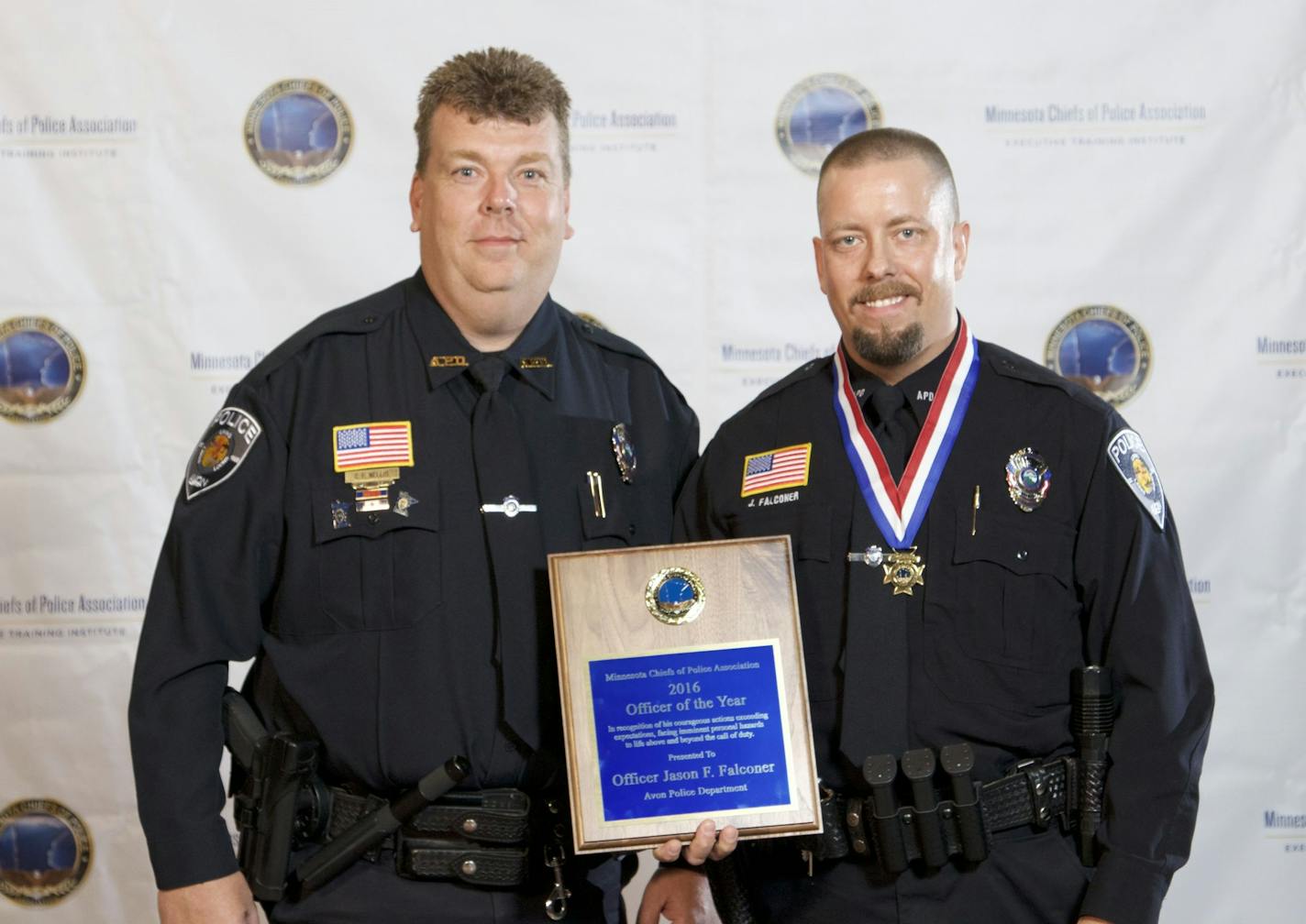 Avon Police Chief Corey Nellis, left, with officer Jason Falconer.