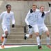 St. Cloud Apollo teammates celebrate Leighton Lommel's goal during the second half of the Class 1A Boys' semifinal game Wednesday, October 29 at Husky