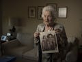 Holocaust survivor Judy Meisel held a photo of herself and her sister that was taken in 1946 in Demark after she was liberated. Judy at left in the pi