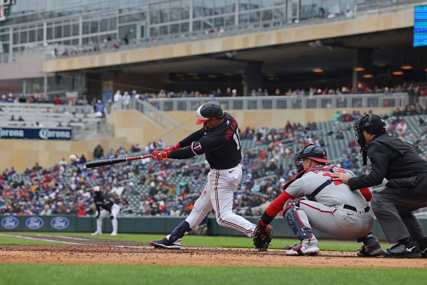 Minnesota Twins Jorge Polanco (11) hits the ball to Washington Nationals first baseman Joey Meneses, not pictured, for an out during the third inning of a baseball game, Saturday, April 22, 2023, in Minneapolis. Washington won 10-4. (AP Photo/Stacy Bengs)