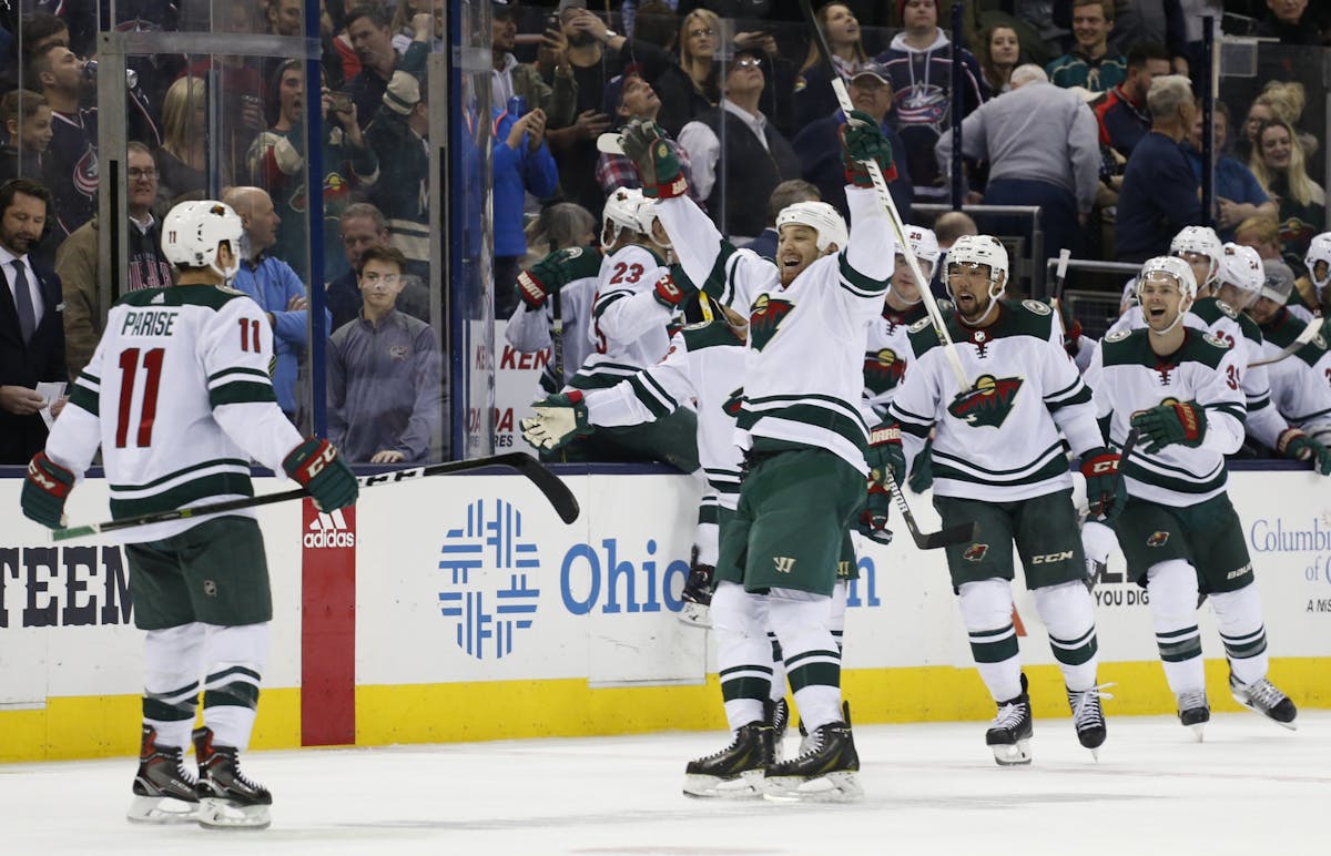 Minnesota Wild players celebrate their win over the Columbus Blue Jackets in an NHL hockey game Tuesday, Jan. 30, 2018, in Columbus, Ohio. The Wild be