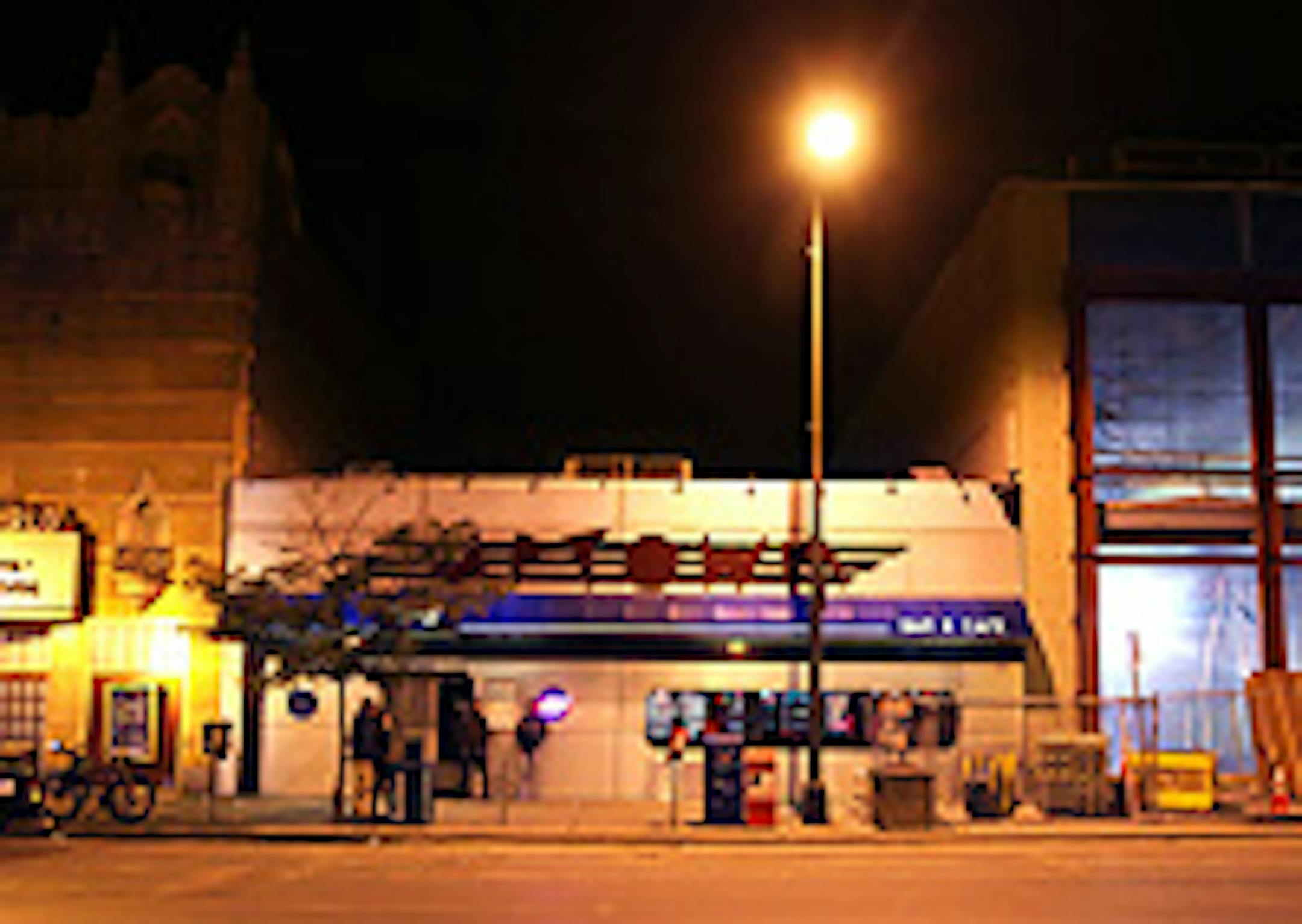 Redevelopment is squeezing the Uptown Bar (center), with a retail building going up next door and another to rise soon where the bar now stands.