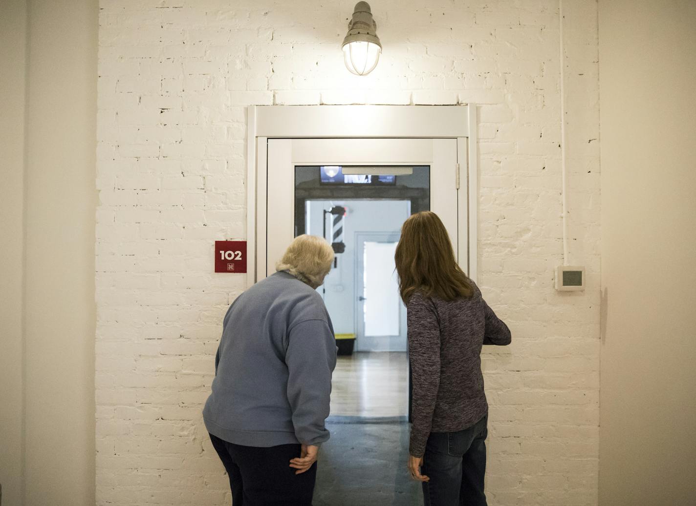 Liz Mattern and Sandy Swanson looked through the former vault entrance as they took a tour of the former RyKrisp building.