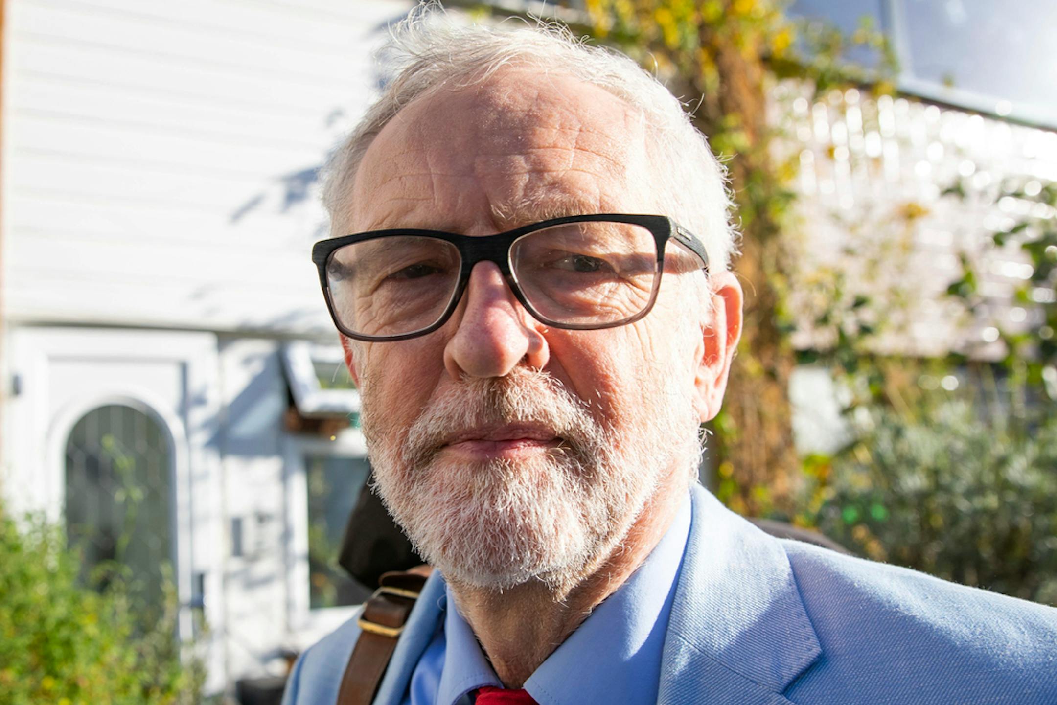 Britain's former opposition Labour Party leader Jeremy Corbyn leaves his home in London, Wednesday Nov. 18, 2020.