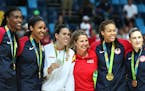 Minnesota Lynx players including Spain&#xed;s Anna Cruz (Silver Medal) pose with coach Cheryl Reeve for pictures with their gold medals. The Lynx's Li