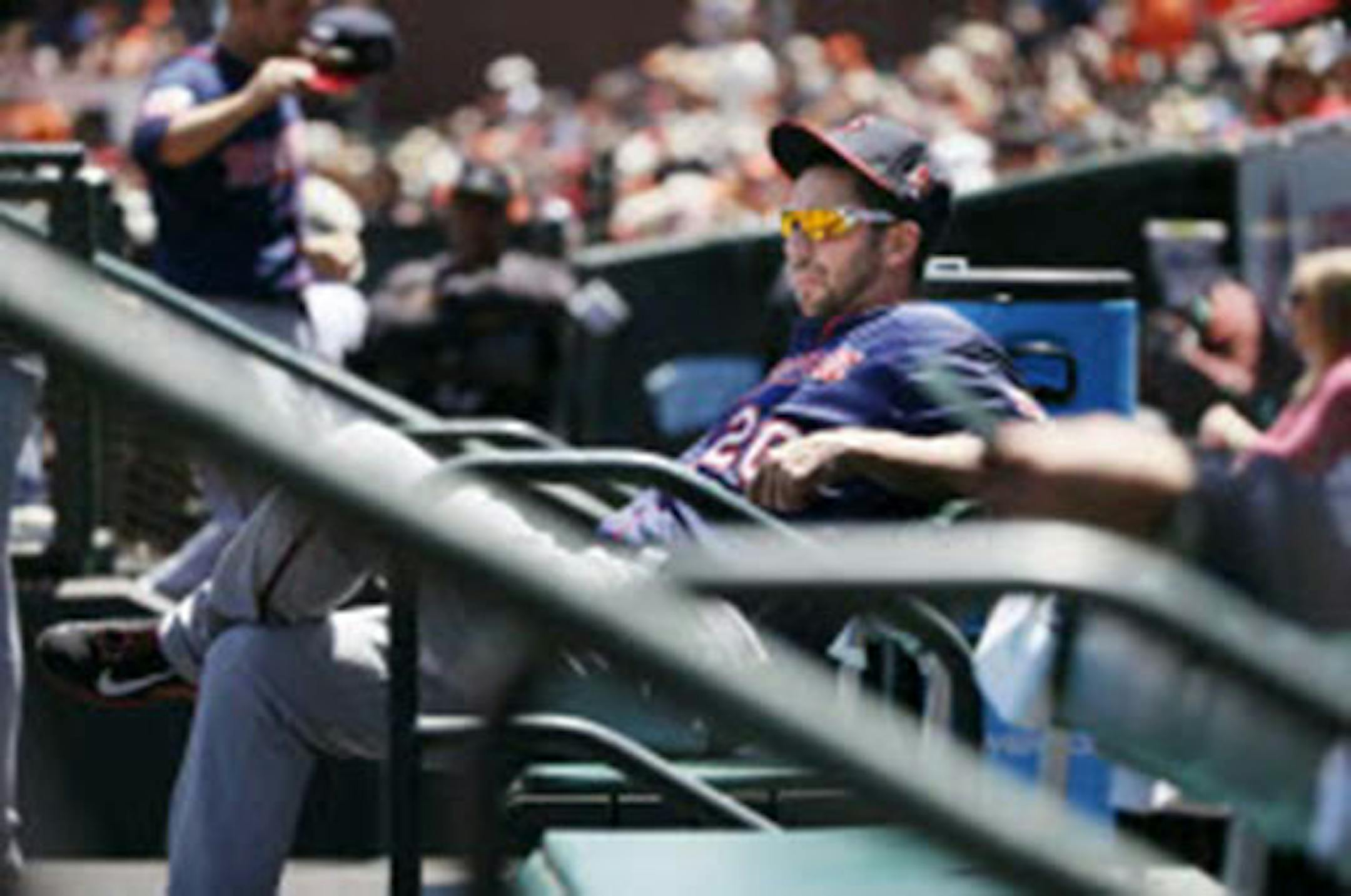 Twins right fielder Chris Colabello sat on the bench at AT&T Park during Sunday's game against the Giants. Colabello was sent down to Class AAA Rochester after the game.