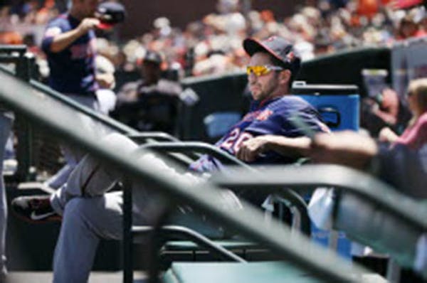 Twins right fielder Chris Colabello sat on the bench at AT&T Park during Sunday's game against the Giants. Colabello was sent down to Class AAA Roches
