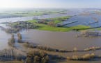 FILE - In this Jan. 8, 2018 file photo taken with a drone shows the flooded village of Rees at river Rhine, Monday, Jan. 8, 2018. Scientists say milli