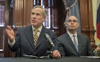 FILE - In this June 21, 2019 file photo, Gov. Greg Abbott, left, speaks at a news conference at the Capitol, in Austin, Texas. Abbott says the state w