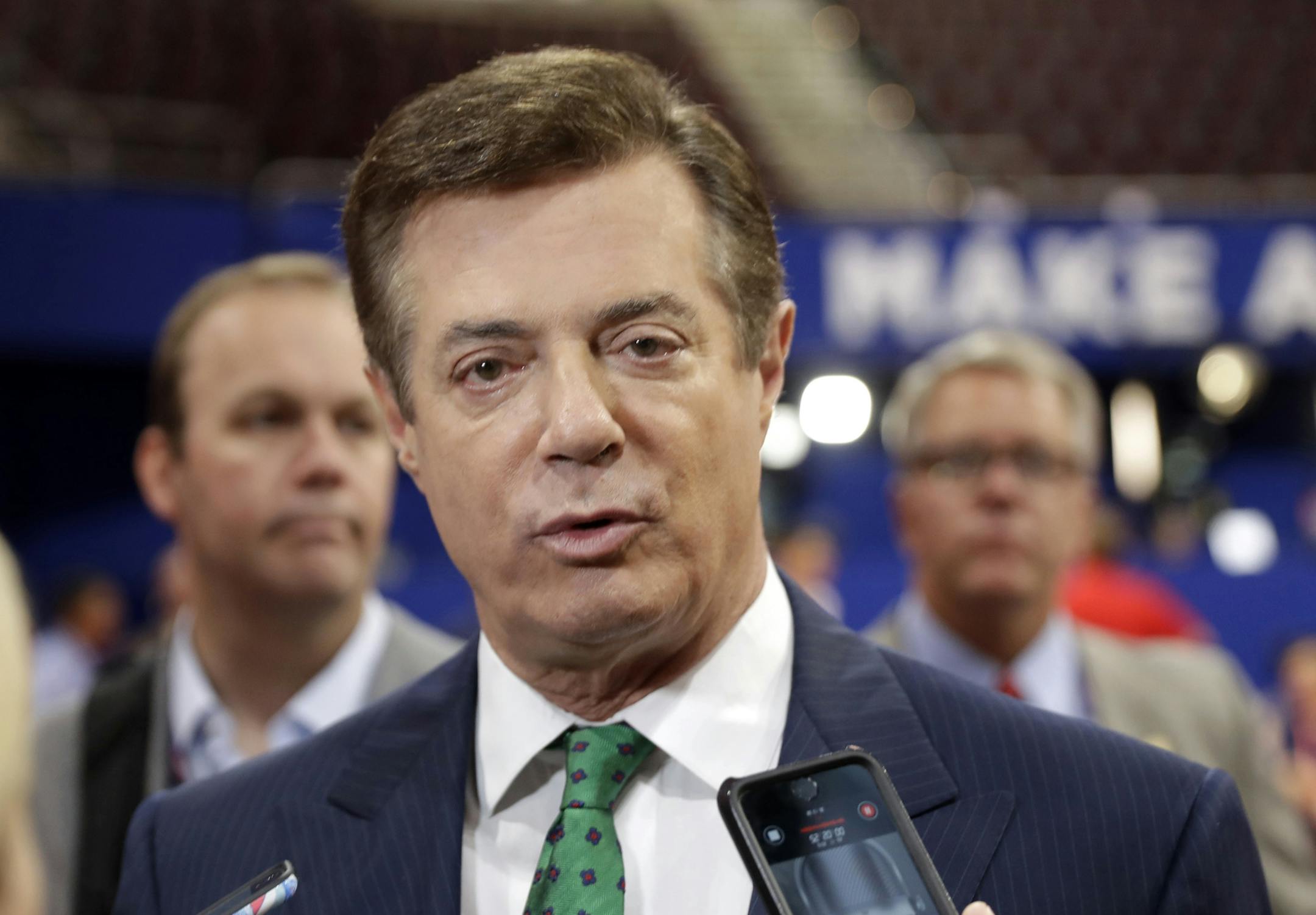 FILE - In this July 17, 2016 file photo, then-Donald Trump campaign chairman Paul Manafort talks to reporters on the floor of the Republican National Convention, in Cleveland. A second Washington lobbying firm that worked under the direction of two former campaign aides to Trump has registered with the Justice Department as a foreign agent. The registration by Mercury LLC comes as the Justice Department waits for Manafort, the former Trump campaign chairman, to file as a foreign agent and disclo
