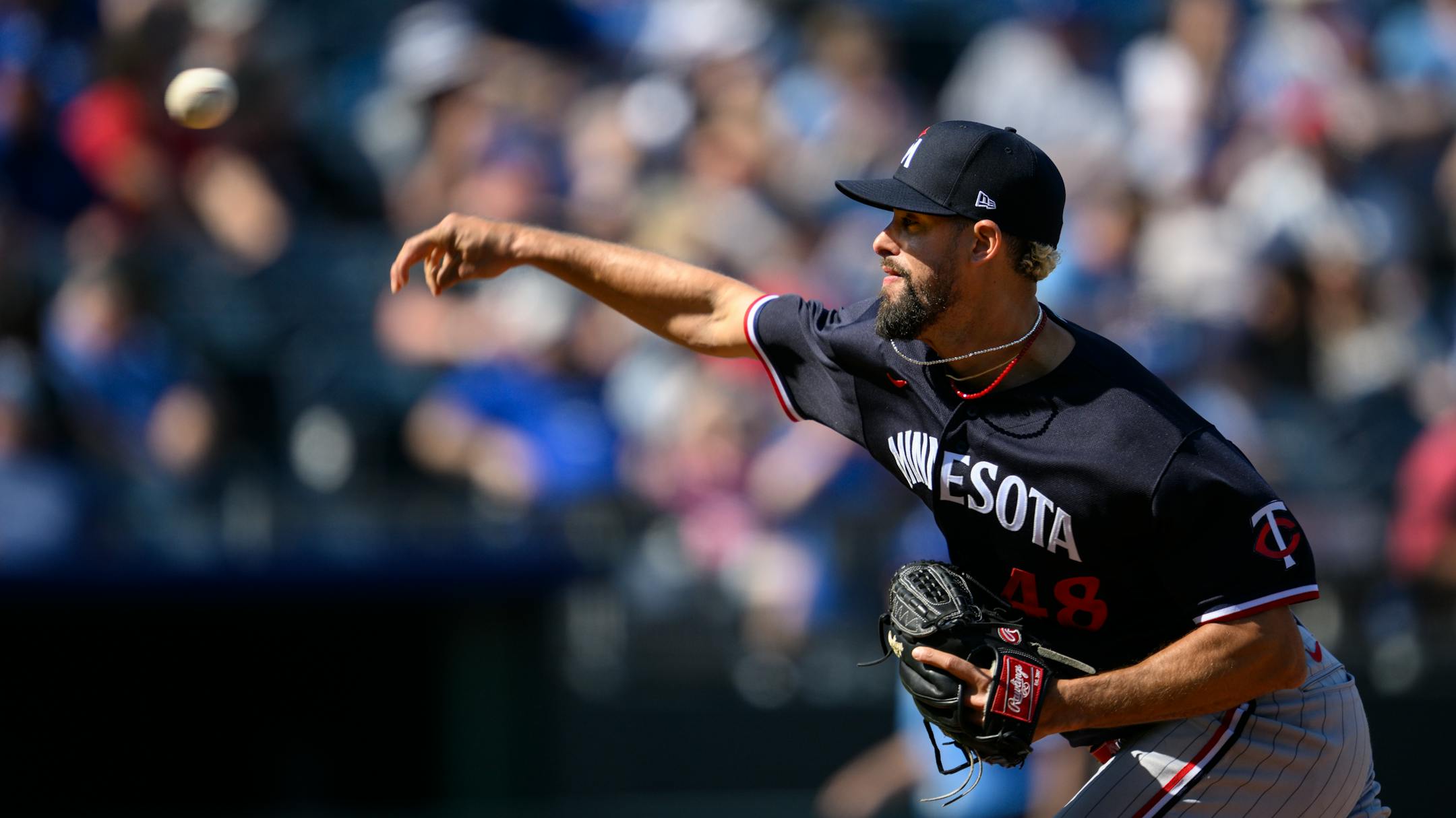 Minnesota Twins relief pitcher Jorge Lopez throws during the eighth inning of a baseball game against the Kansas City Royals, Sunday, April 2, 2023, in Kansas City, Mo. (AP Photo/Reed Hoffmann)