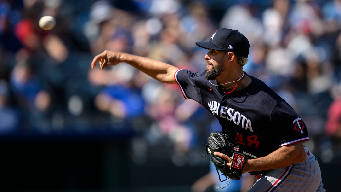 Minnesota Twins relief pitcher Jorge Lopez throws during the eighth inning of a baseball game against the Kansas City Royals, Sunday, April 2, 2023, in Kansas City, Mo. (AP Photo/Reed Hoffmann)