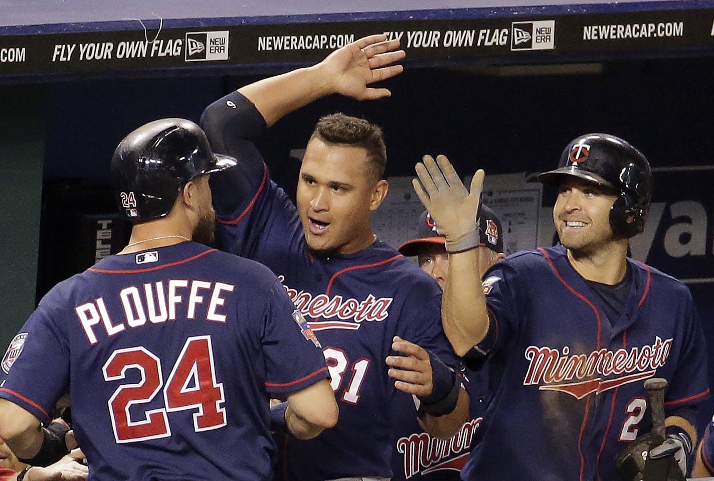 FILE - Minnesota Twins' Trevor Plouffe (24), Oswaldo Arcia (31) and Brian Dozier (2) in August.