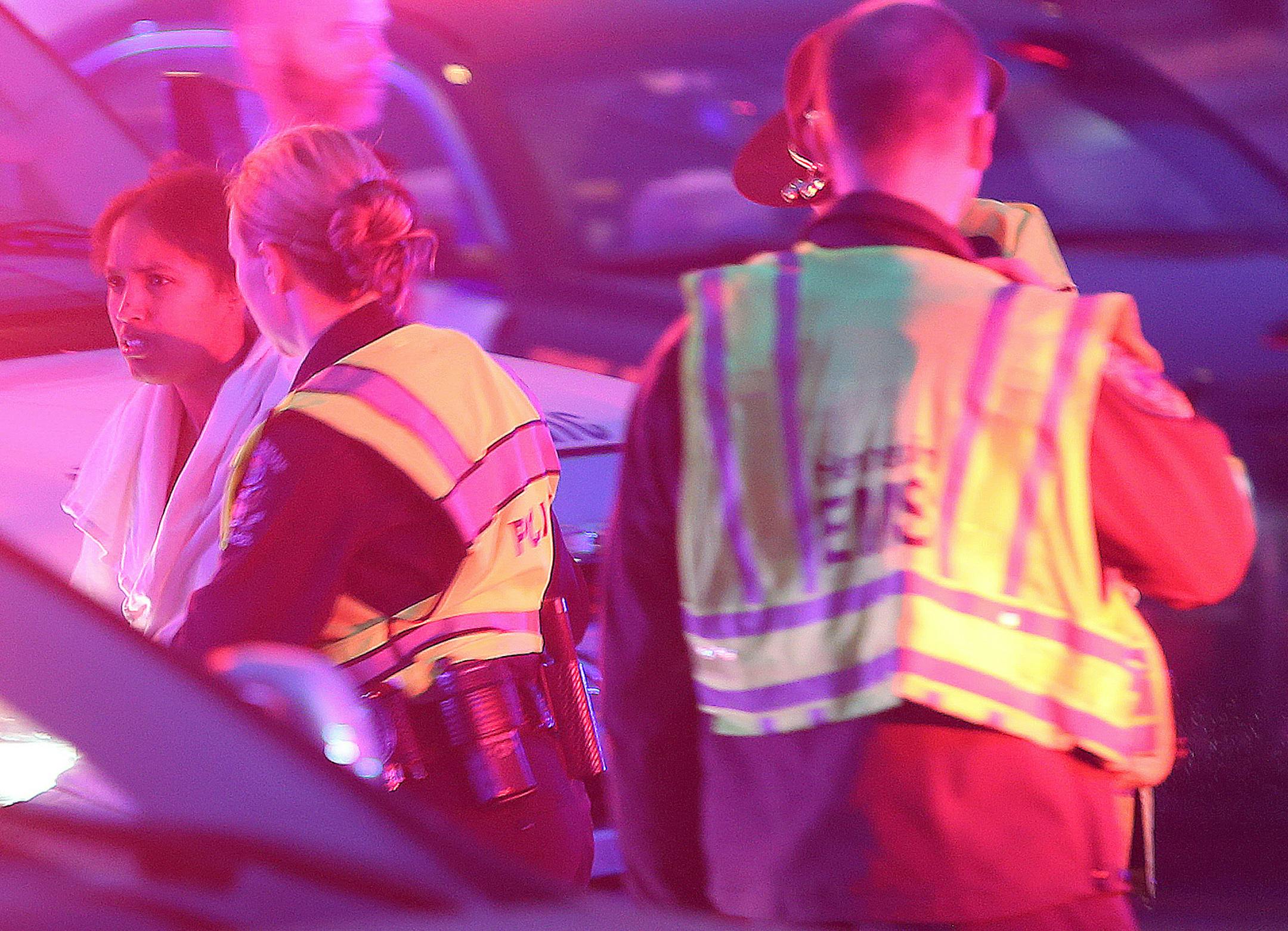 Police led Marion N. Guerrido, the mother of at least three of the children, into an ambulance at the scene where six people were rescued after their car went into a holding pond near the Hwy 100 exit ramp going northbound on Hwy 7, Thursday, November 21, 2013 in St. Louis Park, MN. (ELIZABETH FLORES/STAR TRIBUNE) ELIZABETH FLORES • eflores@startribune.com