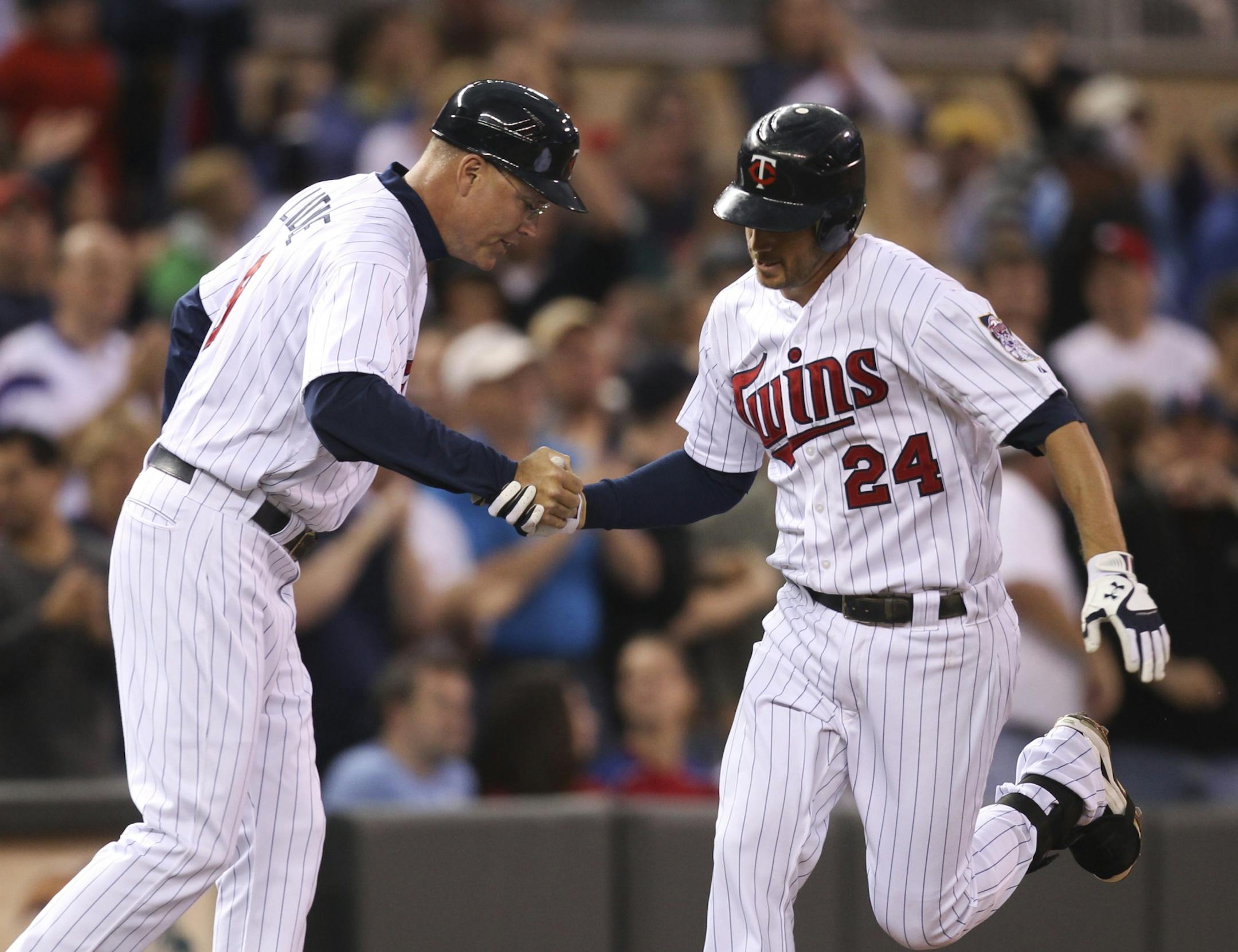 Twins third base coach Steve Liddle congratulated Trevor Plouffe on his solo homer in the second inning. The now-regular third baseman has eight homers in his past 13 games.