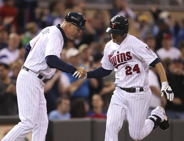 Twins third base coach Steve Liddle congratulated Trevor Plouffe on his solo homer in the second inning. The now-regular third baseman has eight homer