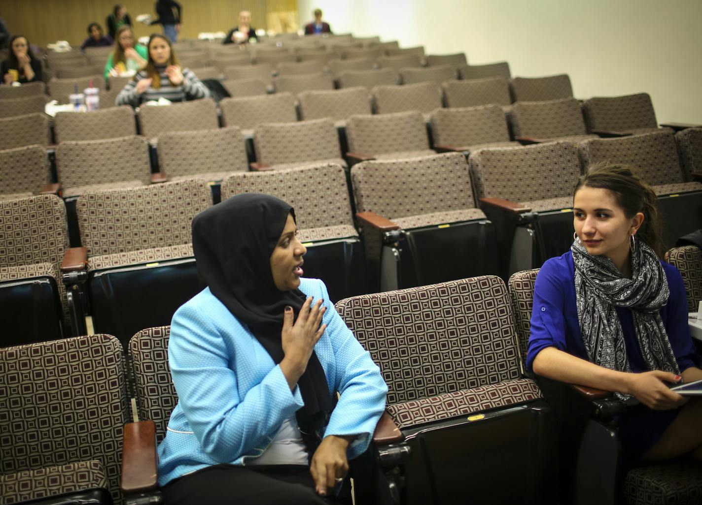 Fartun Weli spoke with Hannah Aho, who was volunteering at the event, as she waited to give a presentation on female genital cutting at a brown bag seminar for University of Minnesota medical students on Thursday, April 2, 2015 at the University of Minnesota in Minneapolis, Minn. ] RENEE JONES SCHNEIDER &#x2022; reneejones@startribune.com