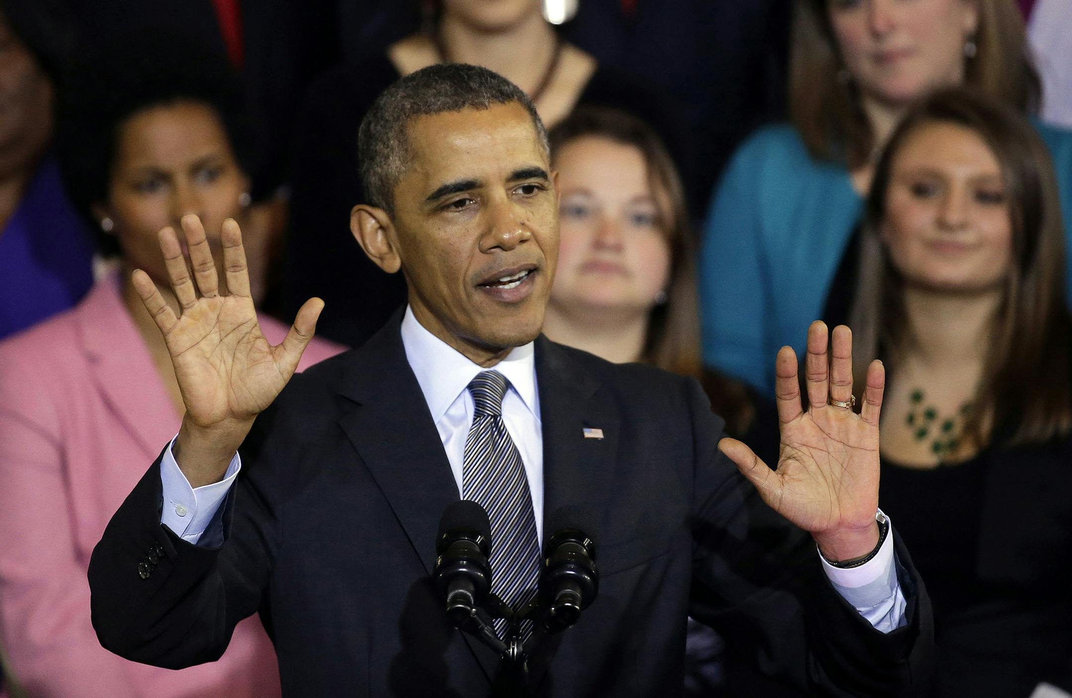 FILE - In this Oct. 30, 2013, file photo, President Barack Obama speaks at Boston's historic Faneuil Hall about the federal health care law. Obama says he's sorry Americans are losing health insurance plans he repeatedly said they could keep under his signature health care law. But the president stopped short of apologizing for making those promises in the first place. "I am sorry that they are finding themselves in this situation based on assurances they got from me," he said in an interview Th