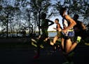 The men's leaders ran past Lake Harriet in the morning light at almost mile 8 during the 2019 Medtronic Twin Cities Marathon in Minneapolis, Minn., on