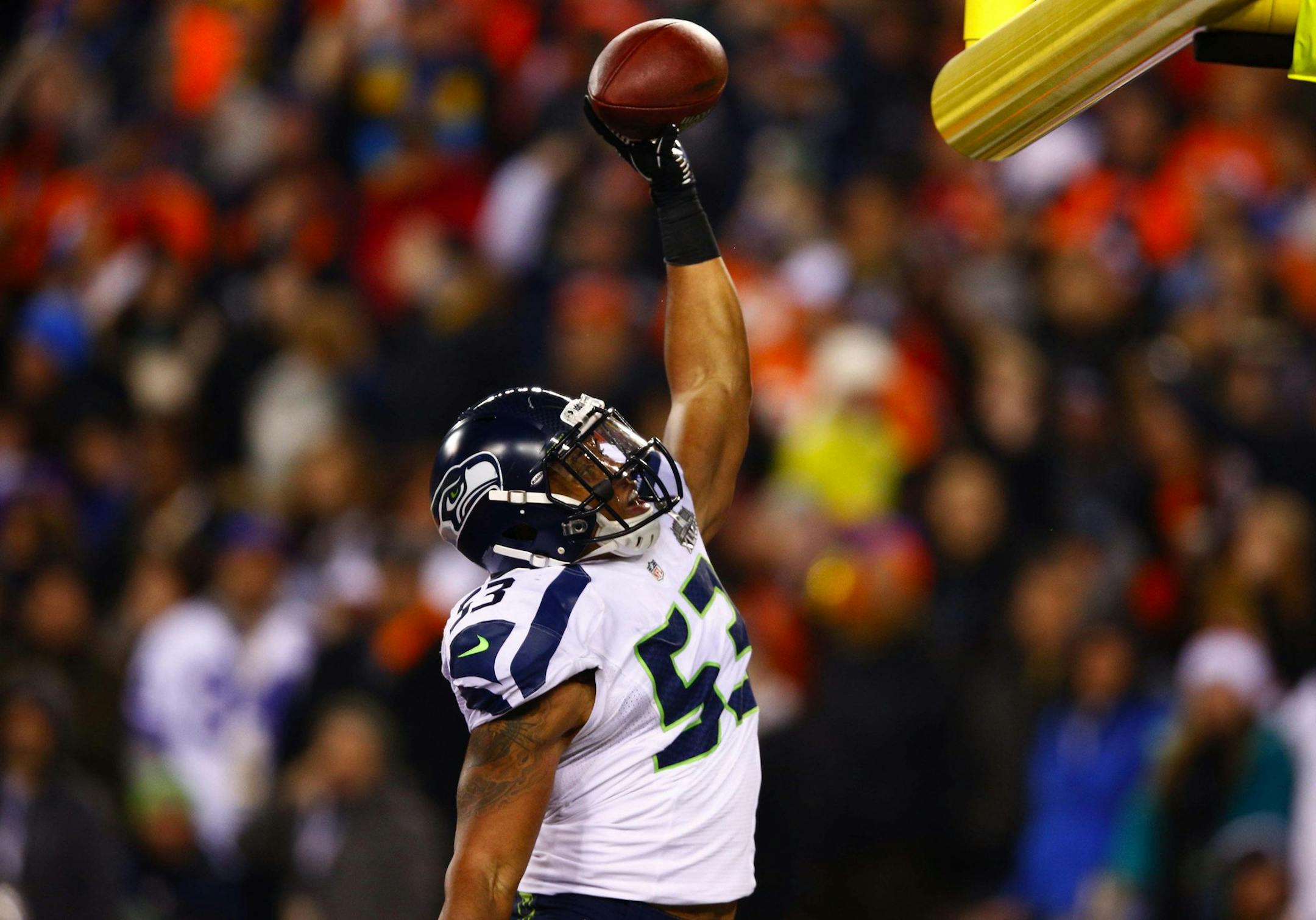 Seattle Seahawks linebacker Malcolm Smith (53) celebrates after intercepting a pass and returning it 69 yards for a touchdown during the second quarter against the Denver Broncos in Super Bowl XLVIII at MetLife Stadium in East Rutherford, N.J., on Sunday, Feb. 2, 2014. Seattle won, 43-8. (John Lok/Seattle Times/MCT)