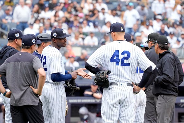 Yankees pitcher Domingo Germán showed his hand to the umpires during the top of the fourth inning Saturday. He was allowed to continue, to the dismay