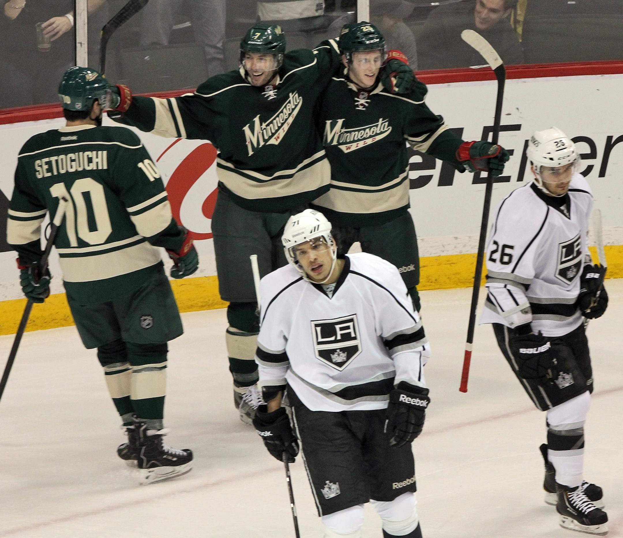 Matt Cullen, middle, was congratulated by teammates after he scored a first period goal. Cullen later iced the victory with a shootout goal.