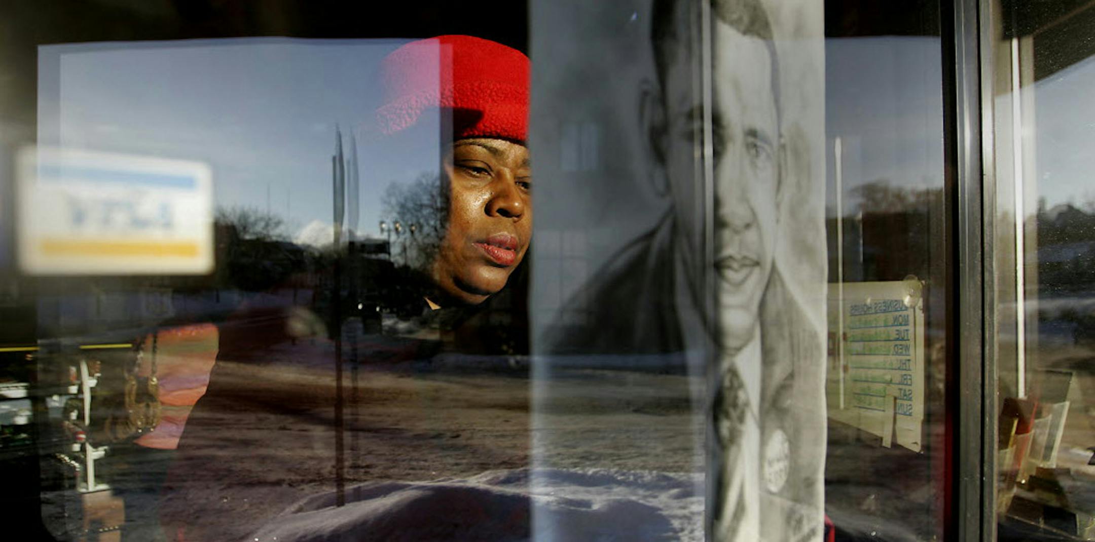 "I believed in him from day one," said Tracene Marshall as she hung a picture of Barack Obama in preparation for an inauguration event at Golden Thyme coffee shop in St. Paul, MN. on Tuesday. Marshall said she worked on his campaign for more than a year and predicted he could beat any Republican candidate.