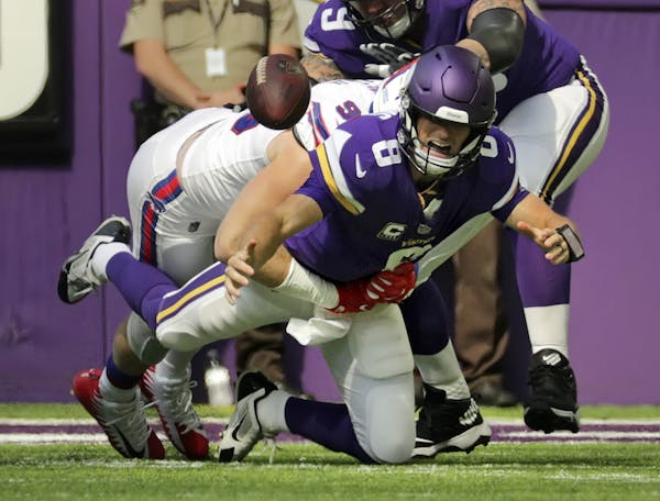 Kirk Cousins was sacked in the first quarter, a sign of bad things to come for the Vikings on Sunday at U.S. Bank Stadium.