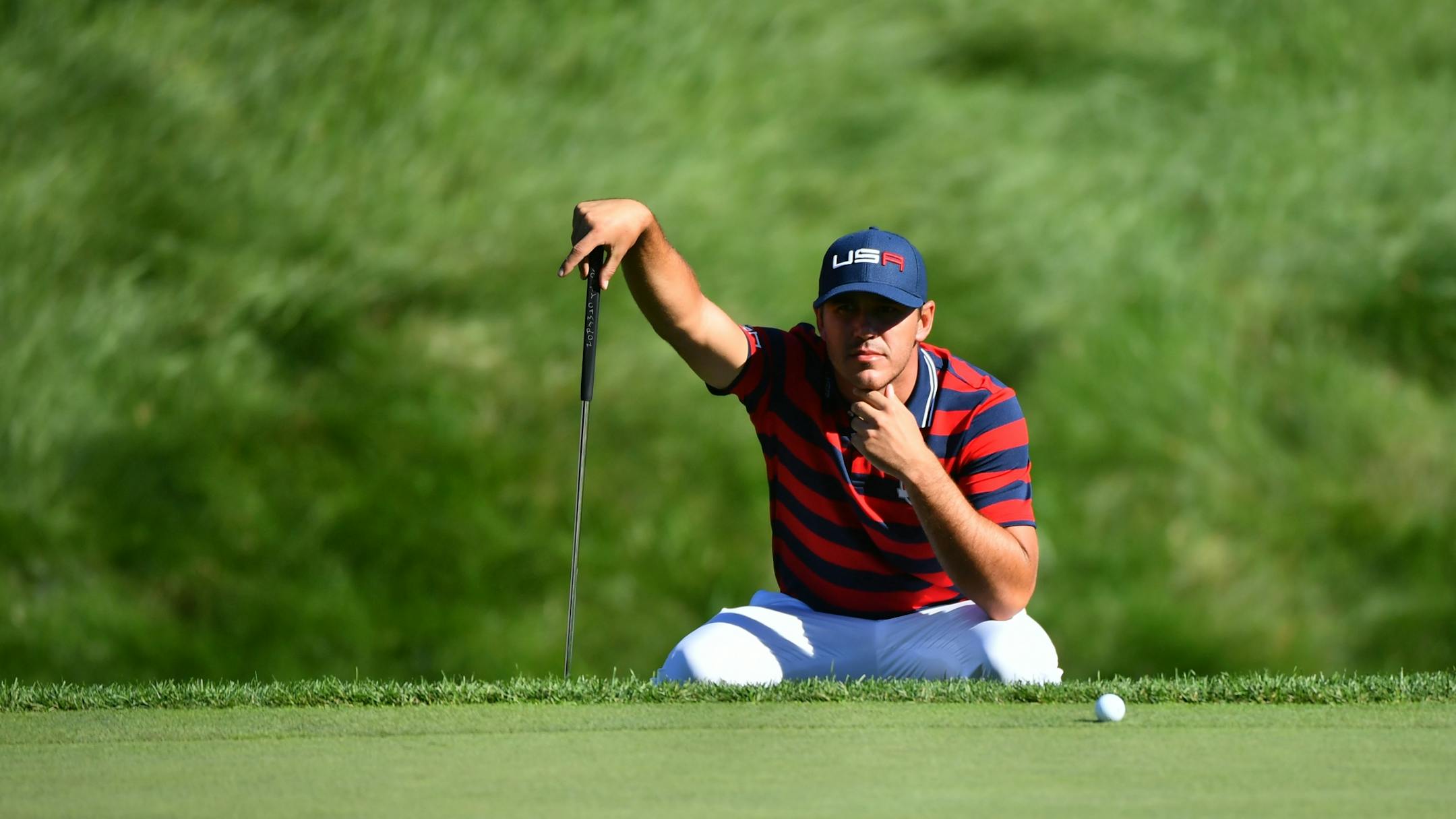 USA's Brooks Koepka lined up his putt on the eighth hole during the afternoon four-ball matches at the Ryder Cup.