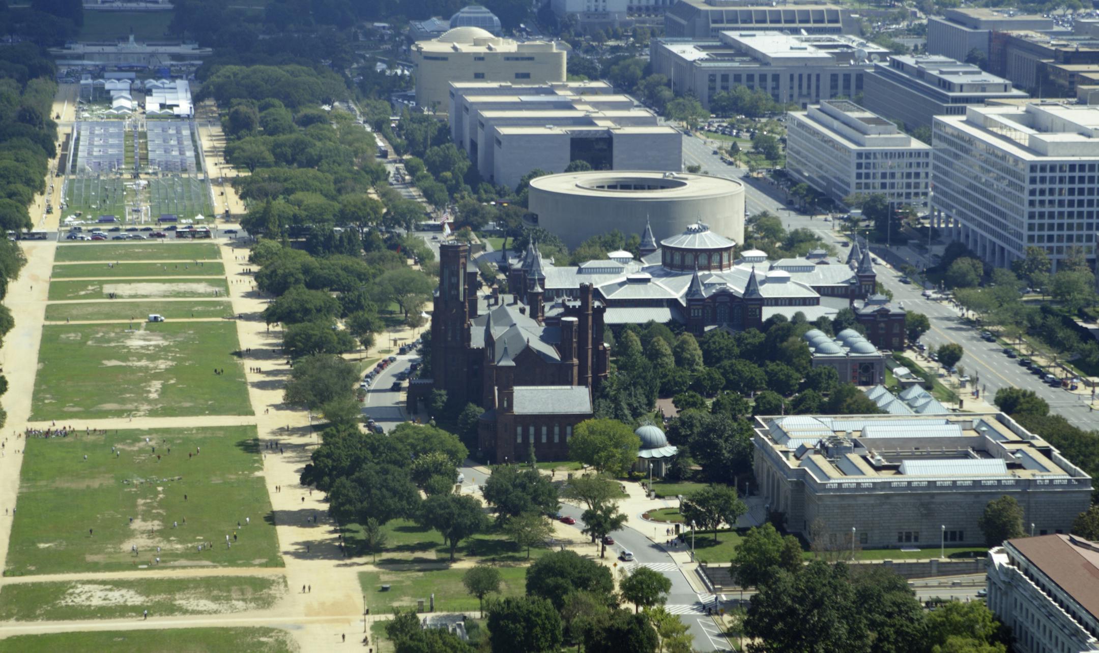 Aerial view of the National Mall in Washington, DC. Shows the Freer, the original Smithsonian building, known as "the Castle", the Arts and Industries building, the Hirshorn museum, the Air and Space Museum, and the Native American Museum. - See lightbox for more
