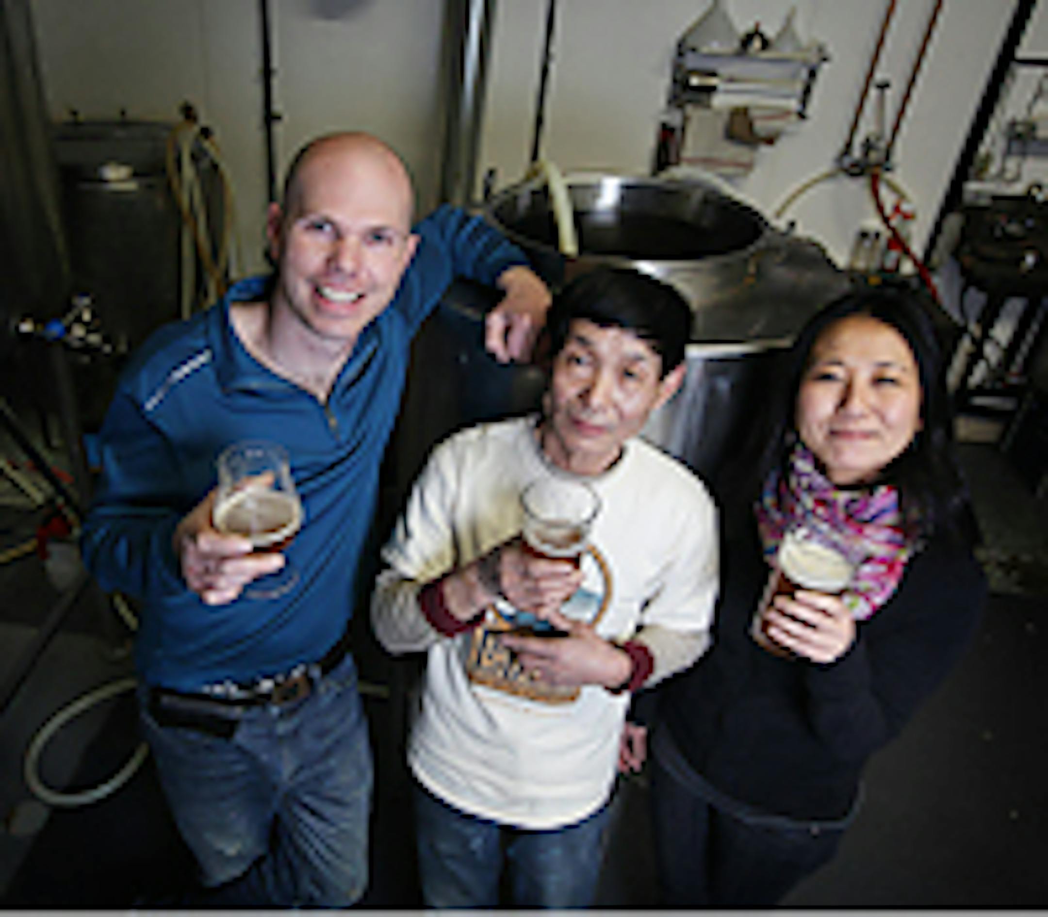 Kevin Welch and Qiuxia Welch with her father, Hu Young Shou