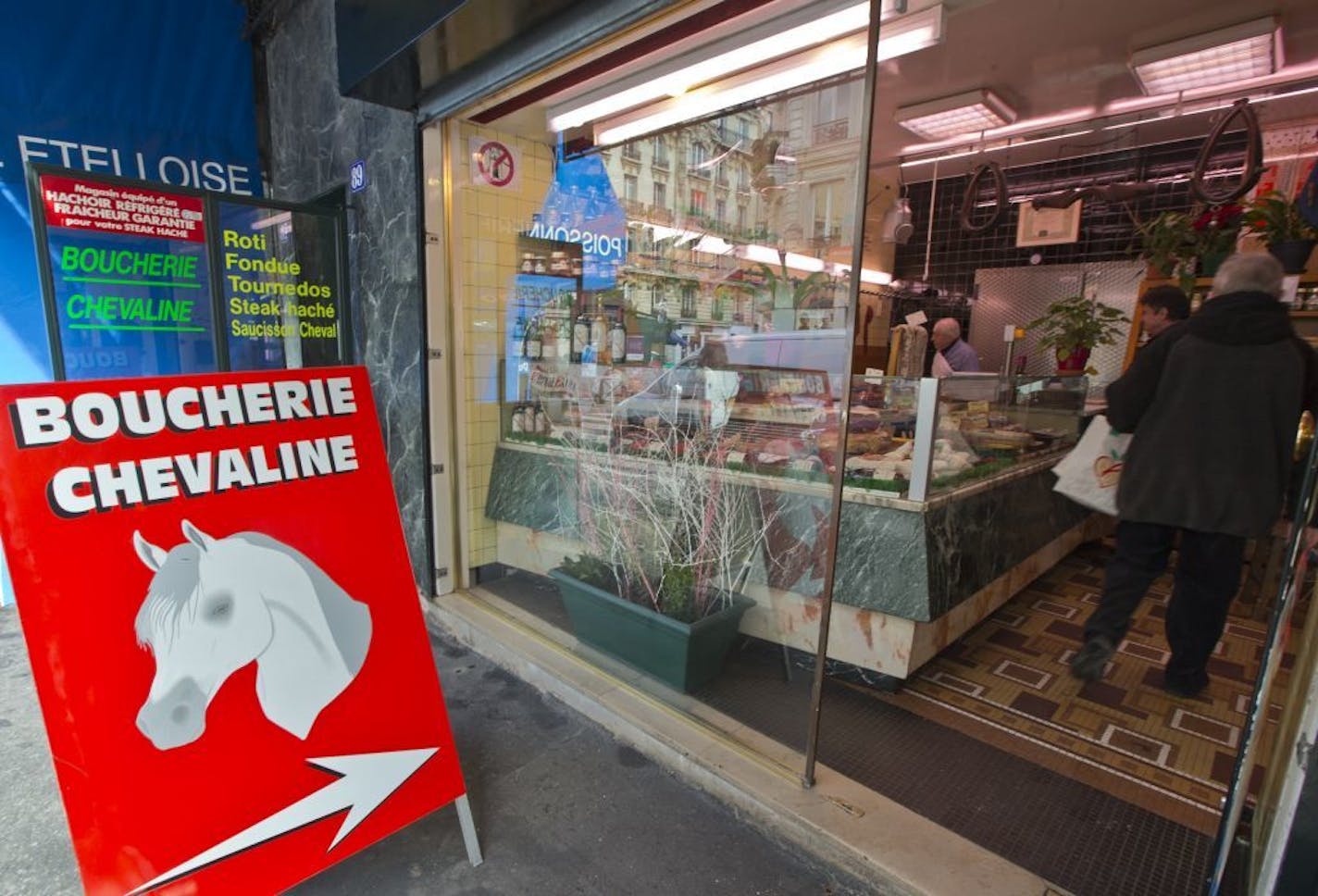 The outside of a butchers where horsemeat is available, in Paris, Friday Feb. 15, 2013. French French Consumer Affairs Minister Benoit Hamon said Thursday that it appeared fraudulent meat sales over several months reached across 13 countries and 28 companies. He identified French meat wholesaler Spanghero as a major culprit.