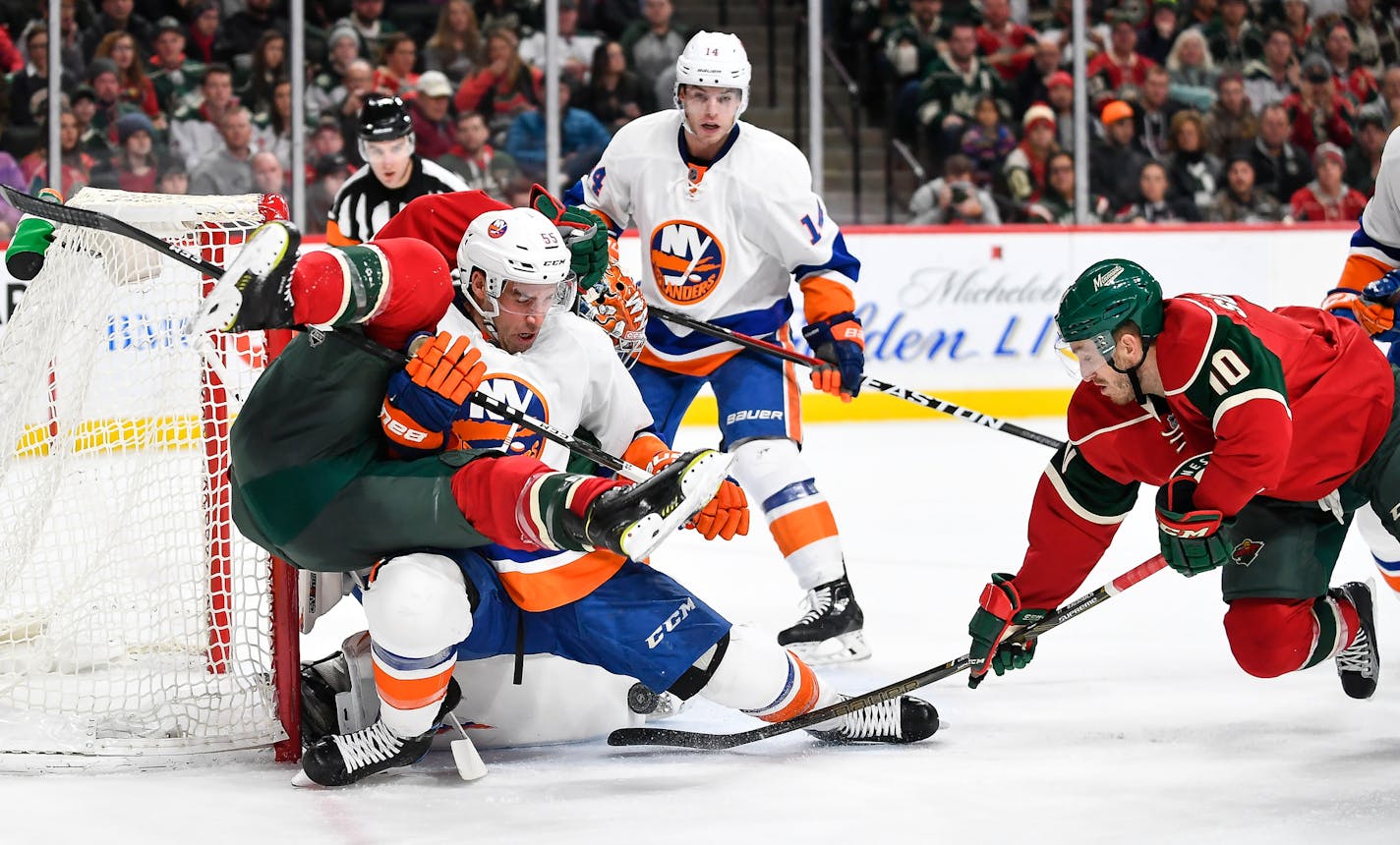 Wild left winger Zach Parise (11) collided with Islanders defenseman Johnny Boychuk (55) as Wild center Jordan Schroeder (10) tried to scored between Boychuk's legs in the second period Thursday. ] (
The Minnesota Wild played the New York Islanders on Thursday, Dec. 29, 2016 at Xcel Energy Center in St. Paul, Minn.