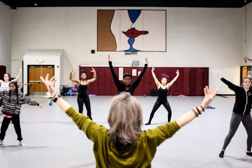 Instructor Mary Harding, bottom center, led a warmup for Perpich ballet students Wednesday afternoon.