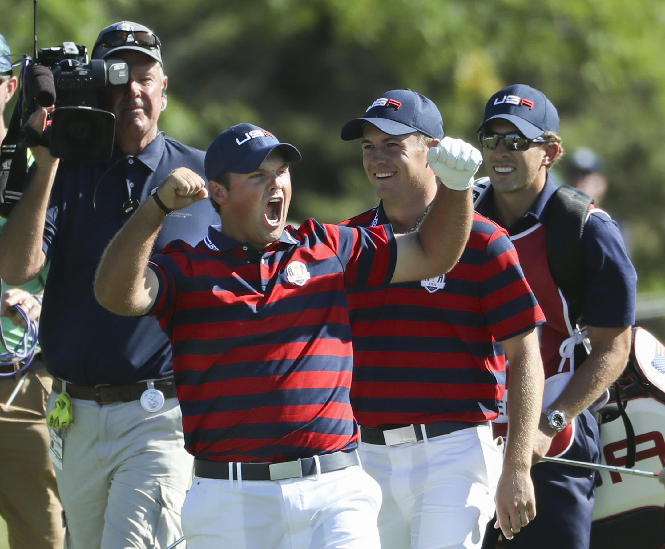 Patrick Reed holes out for eagle on the sixth hole in the fourball matchup Saturday afternoon against the European team of Justin Rose and Henrik Stenson.
