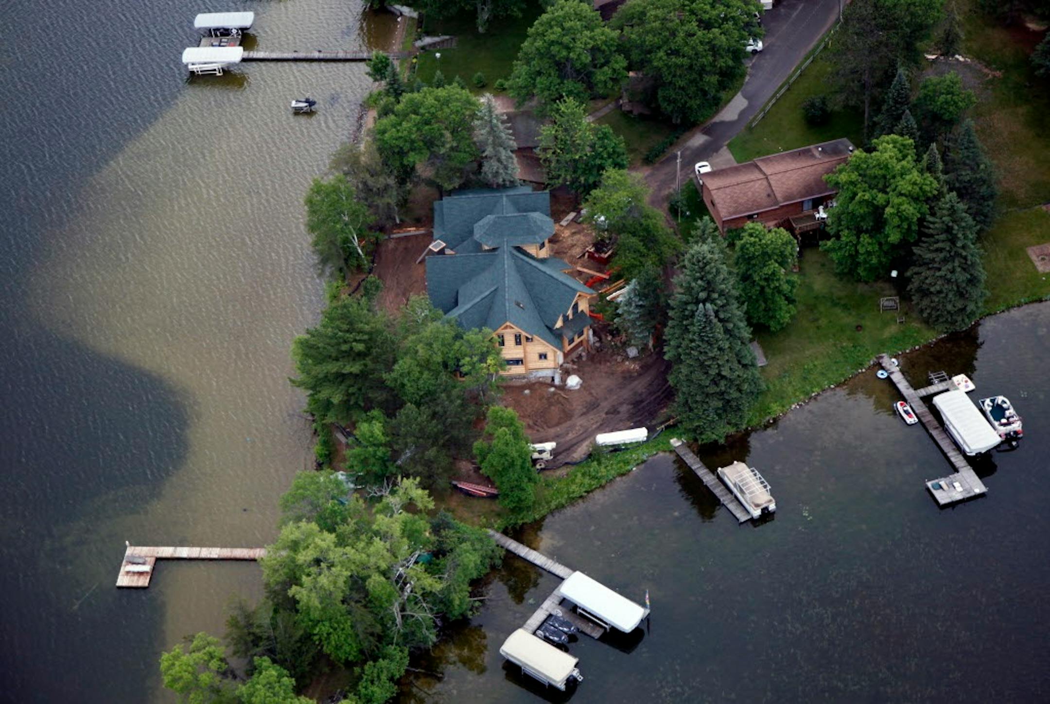 BRIAN PETERSON � brianp@startribune.com Brainerd, MN 5/20/2010 ] In 2004 the Cross Lake city council decided to abandon rules that placed sharp limits on builders. The new ordinance allowed Paul Gavic to build this waterfront dream house on Cross Lake. The 6,000 square foot lake home was allowed to be built on a small peninsula just 39.1 feet from the water - versus the state standard of 75 feet. "I know there are people who want teeny weenie docks and little wooden boats so that every little pi