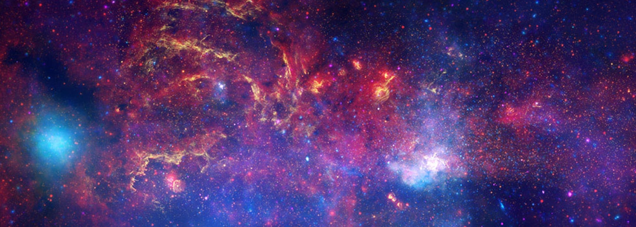 This image provided by NASA Tuesday Nov. 11, 2009 shows observations from the Hubble Space Telescope, the Spitzer Space Telescope, and the Chandra X-ray Observatory in a collaboration to produce an unprecedented image of the central region of our Milky Way galaxy using infrared light and X-ray light to see through the obscuring dust and reveal the intense activity near the galactic core. Note that the center of the galaxy is located within the bright white region to the right of and just below t