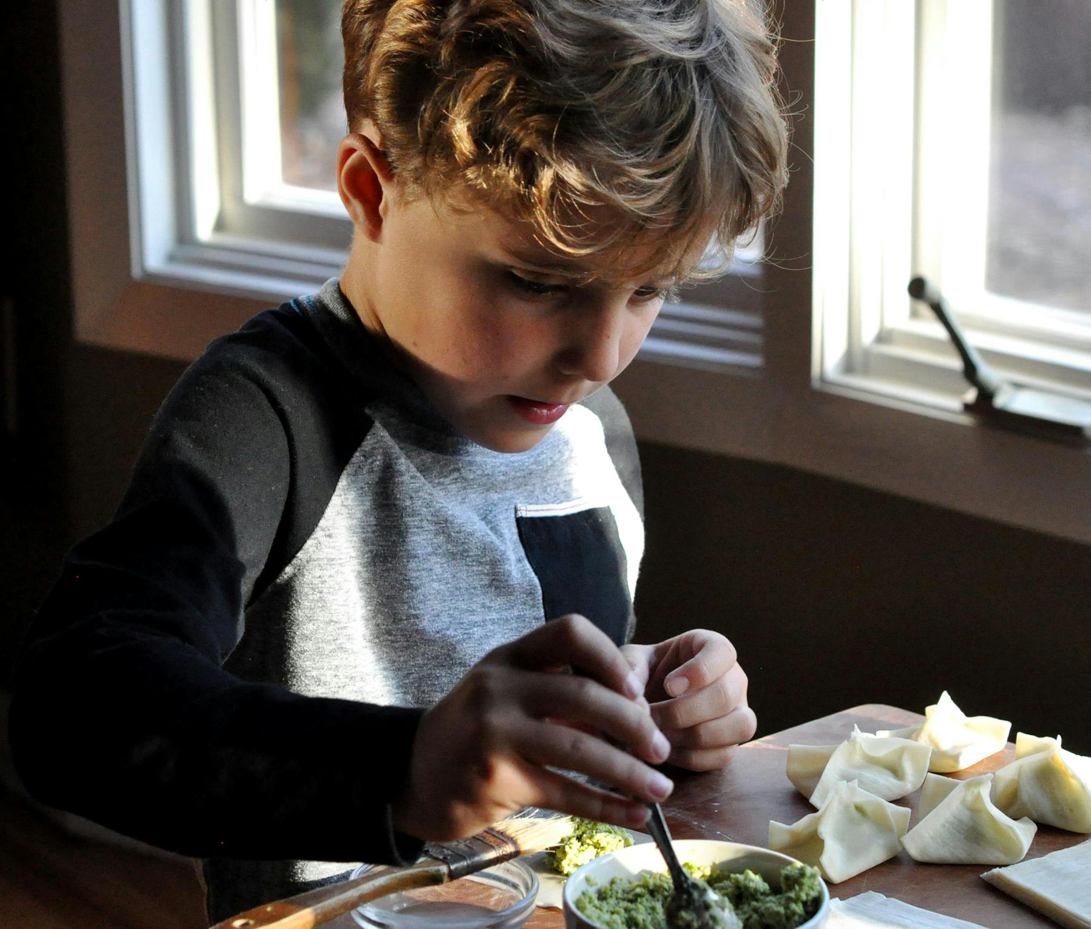Trent Fryer helped make edamame potstickers with his great-aunt, Meredith Deeds.