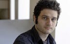 FILE-In this April 26, 2012 file photo, Dustin Moskovitz, a Facebook co-founder, poses outside of his office in San Francisco. Moskovitz says he is gi