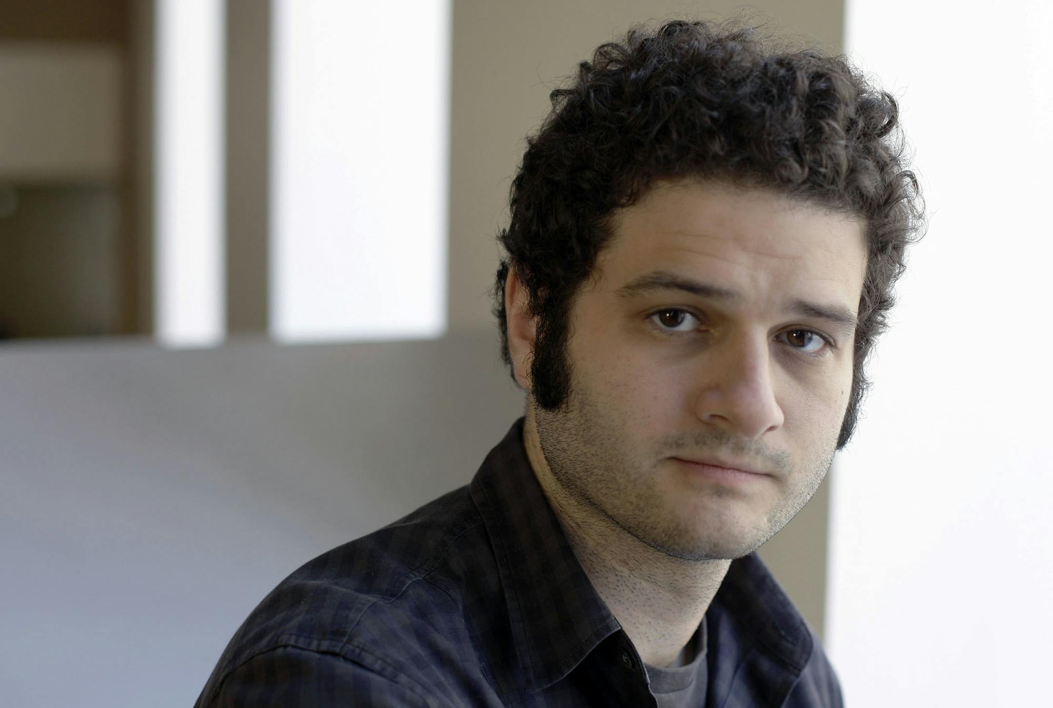 FILE-In this April 26, 2012 file photo, Dustin Moskovitz, a Facebook co-founder, poses outside of his office in San Francisco. Moskovitz says he is giving $20 million to help defeat Donald Trump, calling the Republican presidential candidate divisive and dangerous and his appeals to Americans who feel left behind "quite possibly a deliberate con." (AP Photo/Eric Risberg)